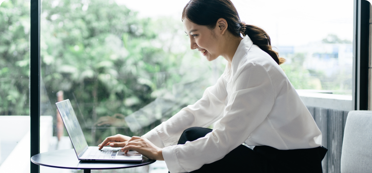 Photo of a woman working on her computer 